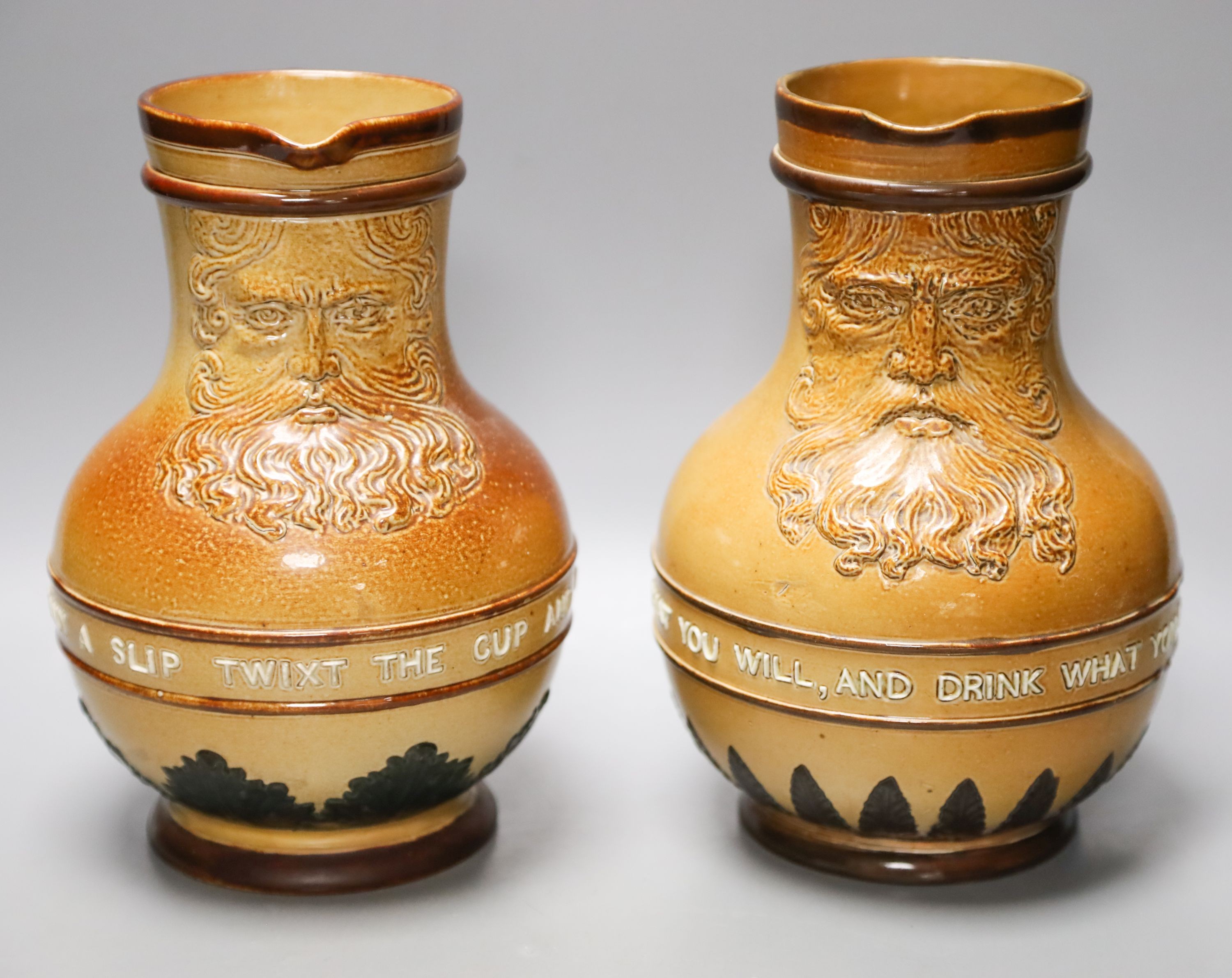 Two Doulton Lambeth salt-glazed stoneware Bellarmines with mottos, 21.5cm